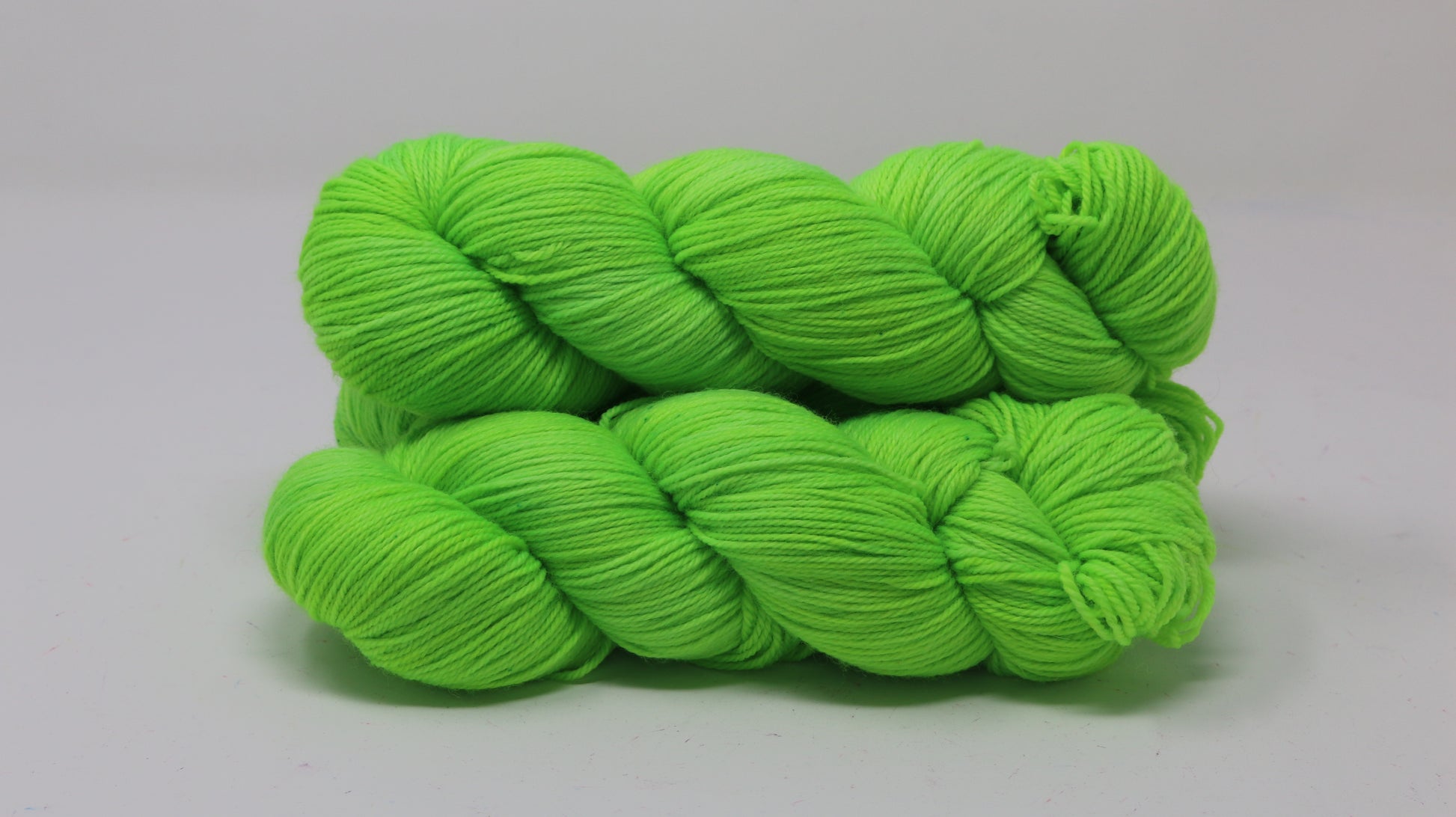 Three skeins of neon green yarn