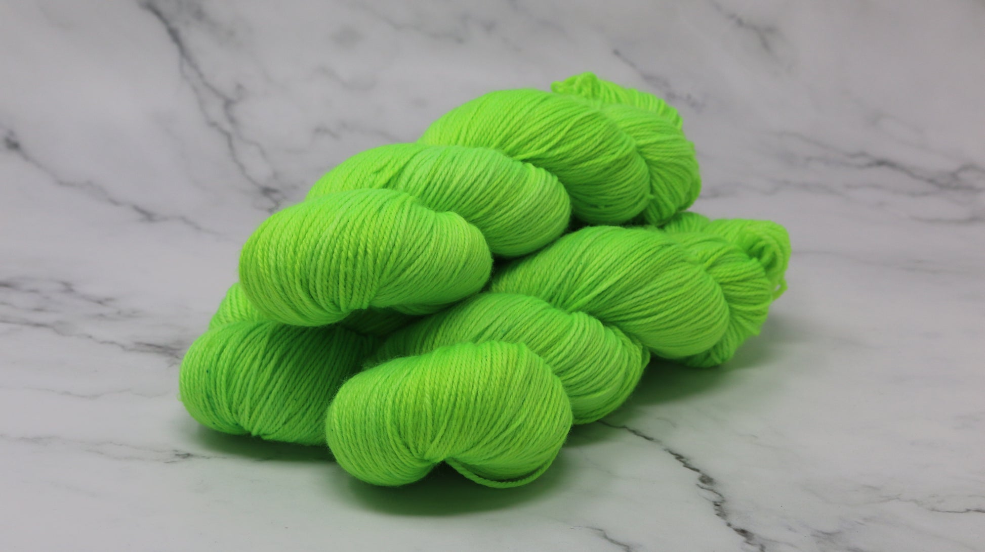 Three skeins of neon green yarn