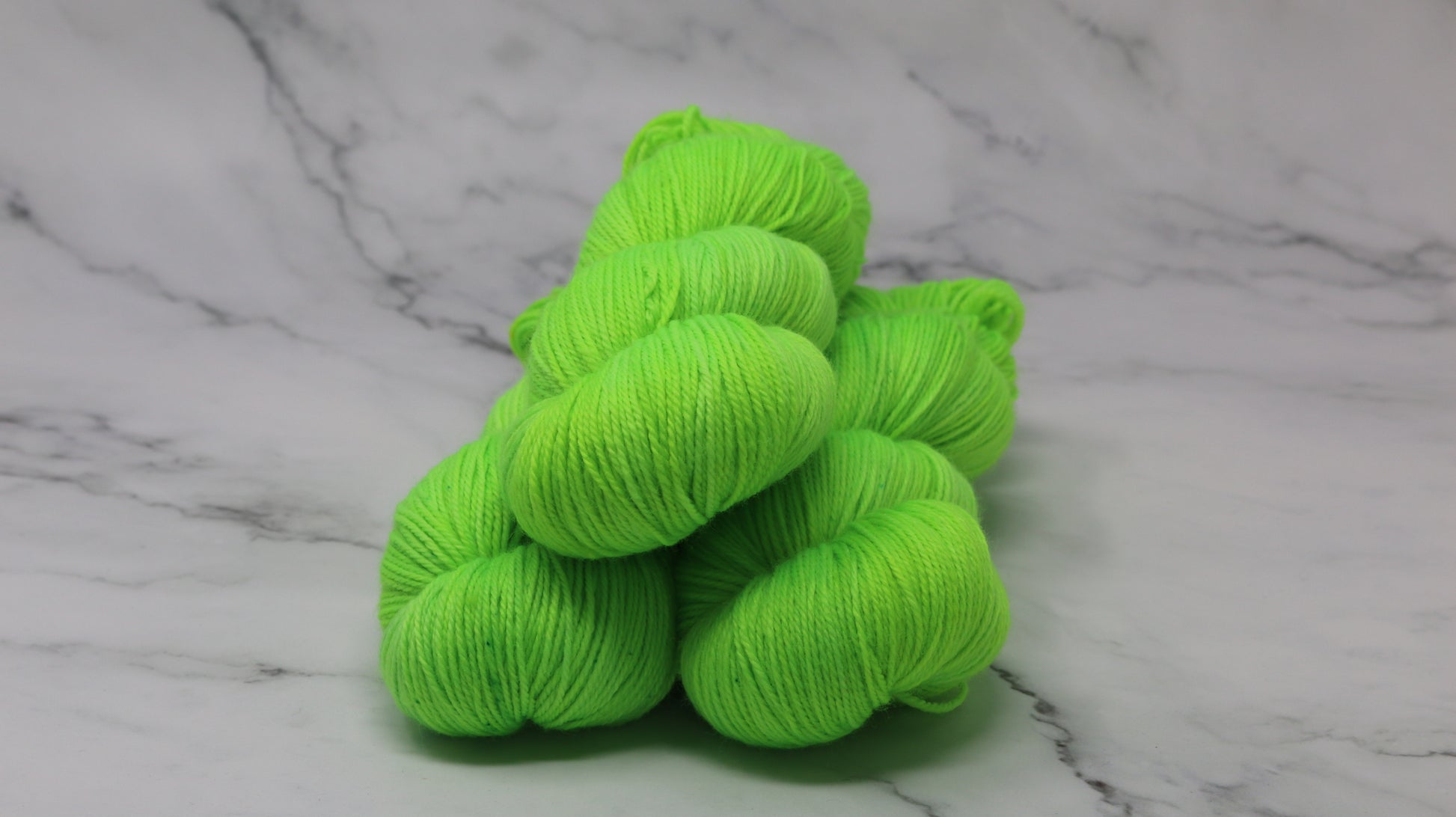Three skeins of neon green yarn