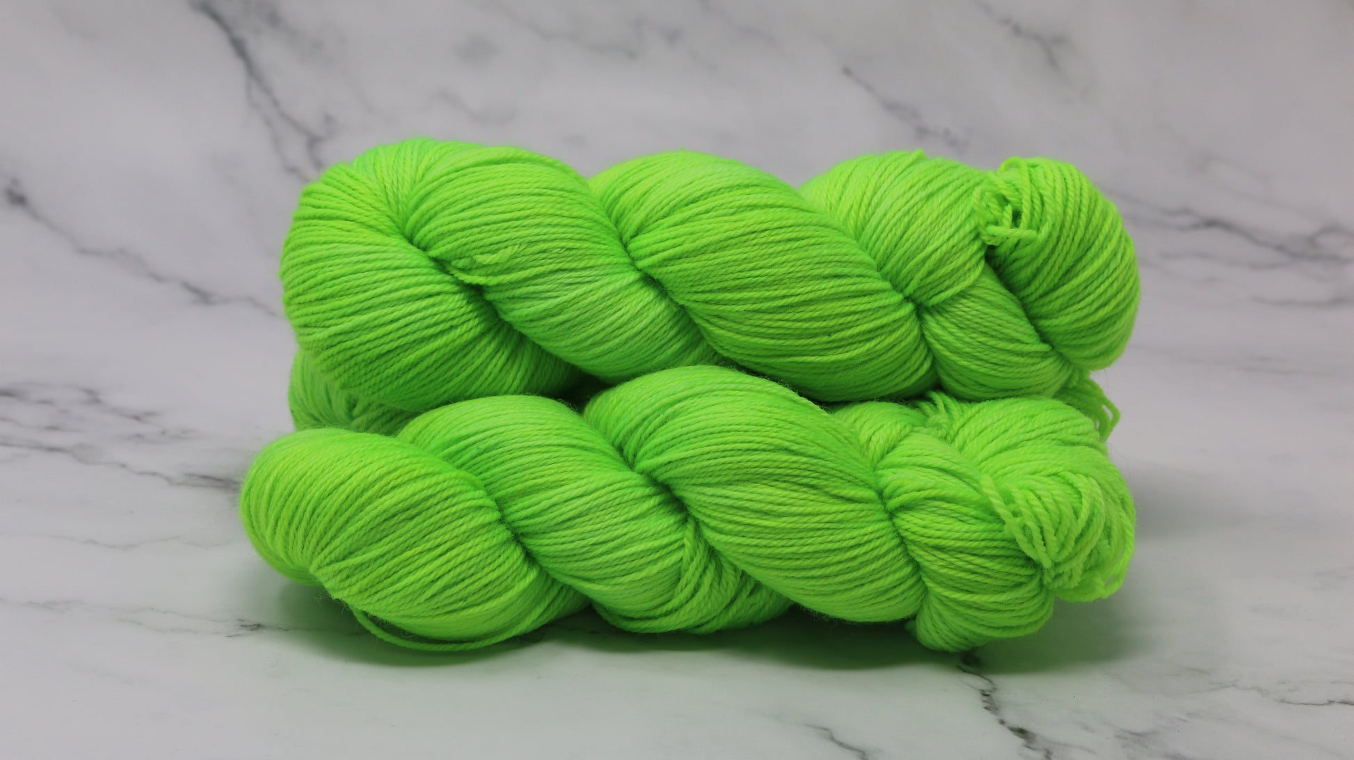 Three skeins of neon green yarn