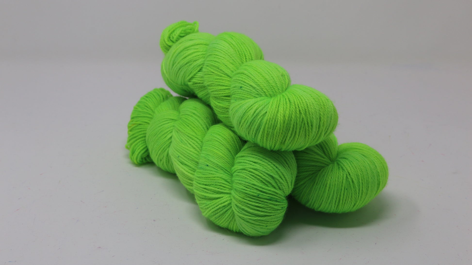 Three skeins of neon green yarn