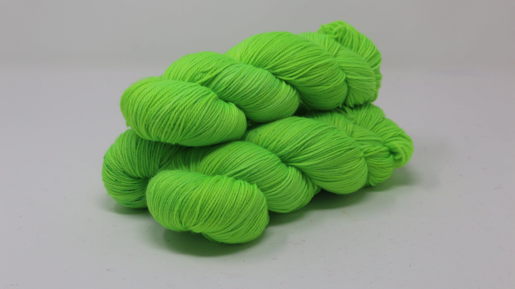 Three skeins of neon green yarn