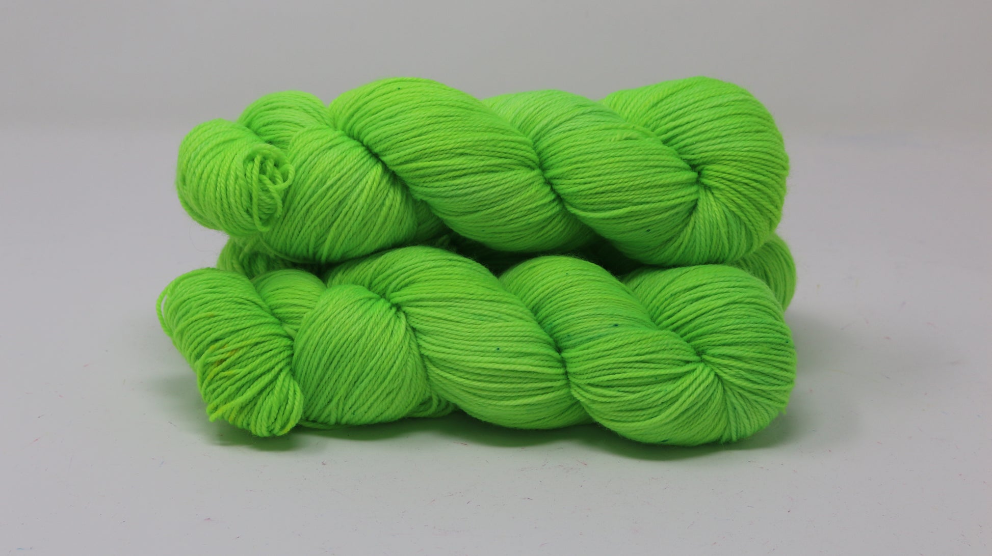 Three skeins of neon green yarn