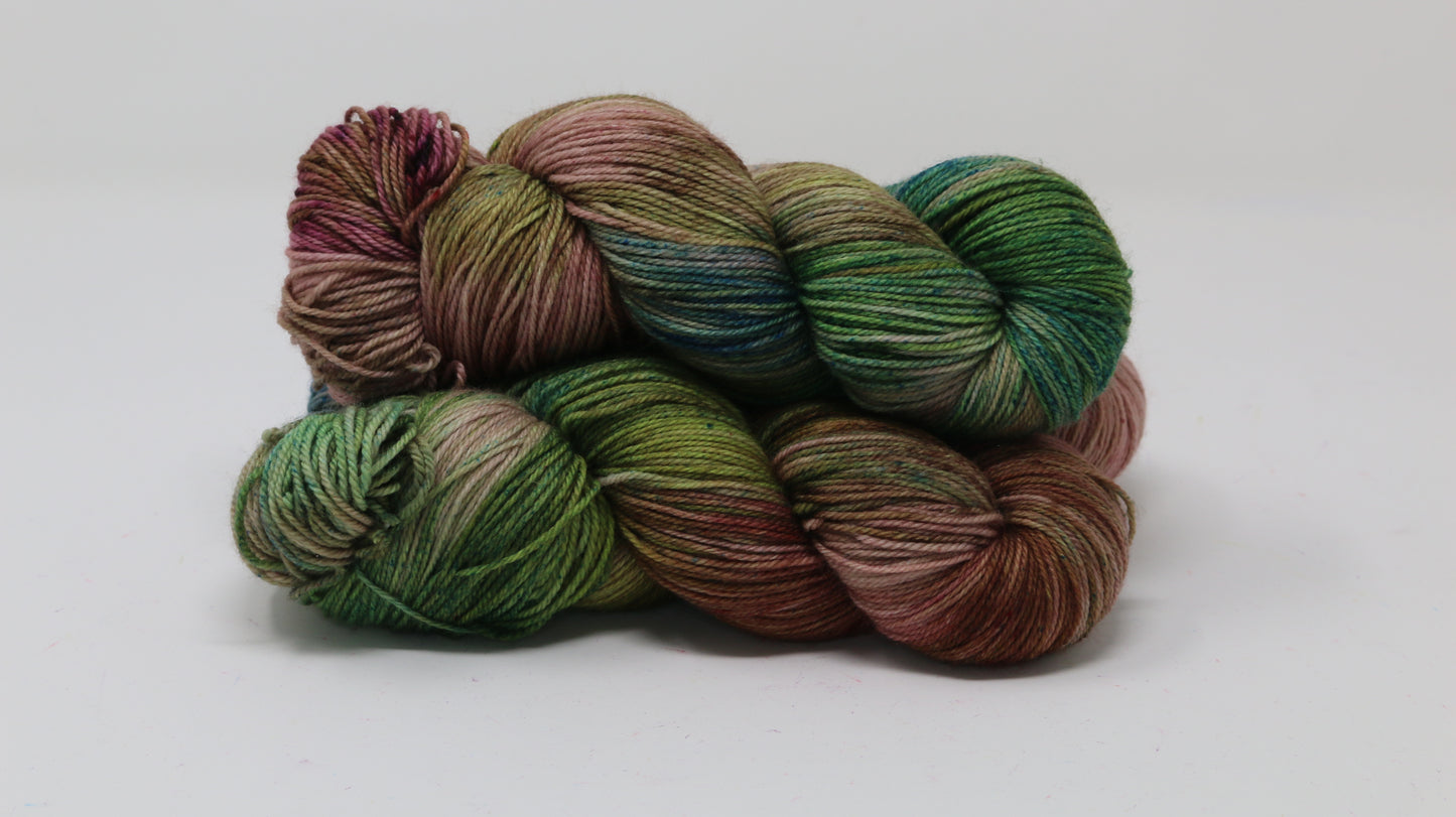 3 skeins of brown, green, blue yarn