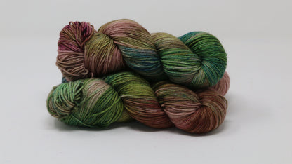3 skeins of brown, green, blue yarn