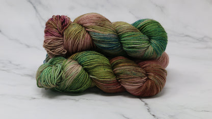3 skeins of brown, green, blue yarn